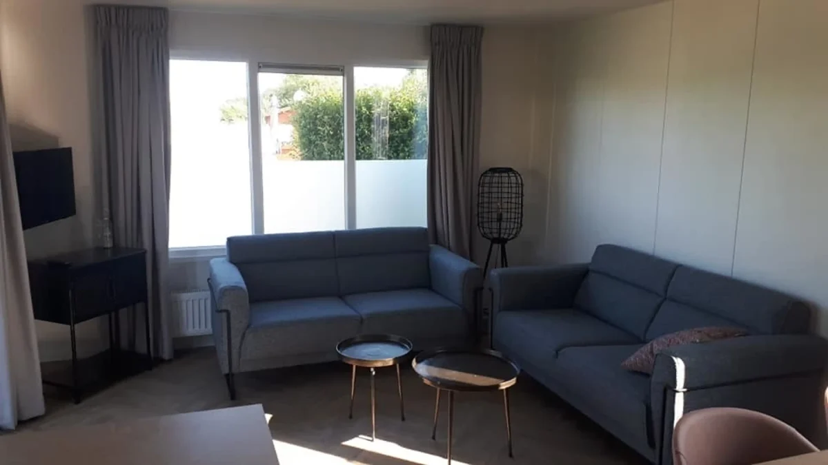 Woonkamer van chalet op Camping Wulpen